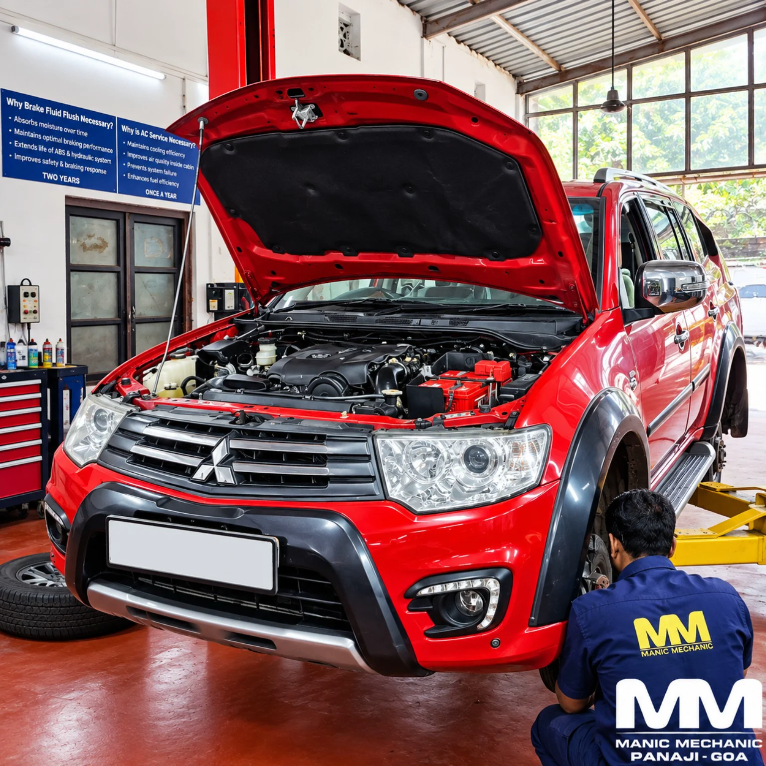 Red Mitsubishi SUV receiving annual service at Manic Mechanic Goa