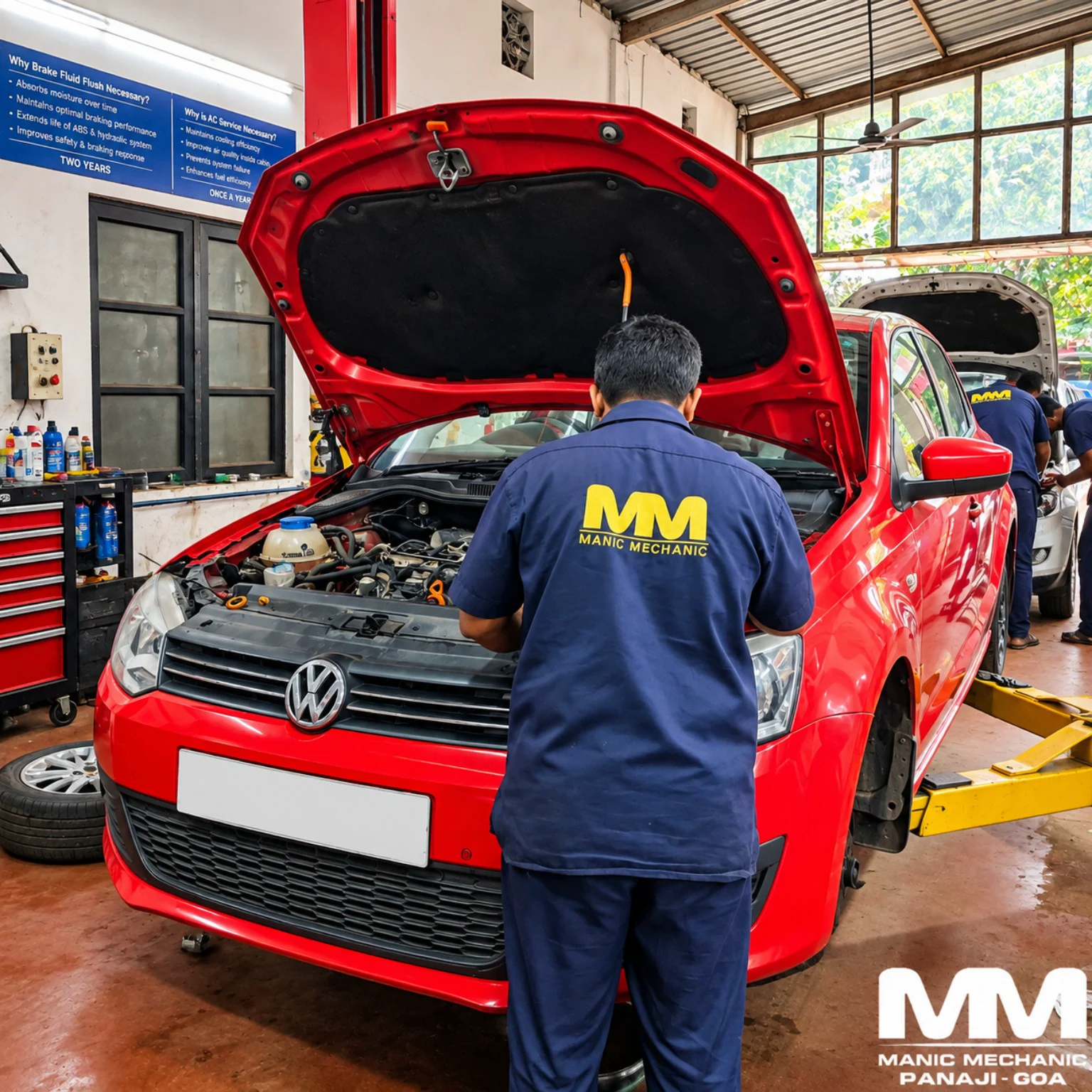 Red Volkswagen hatchback receiving annual service at Manic Mechanic Goa